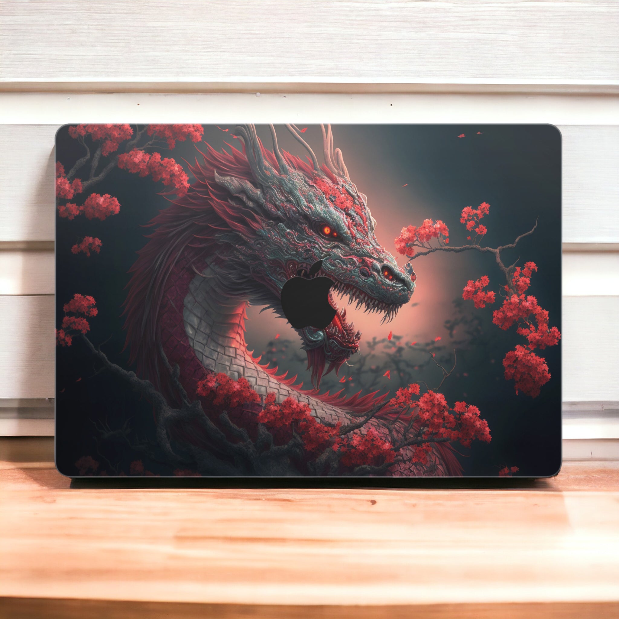 Close-up view of a Dragon design MacBook skin sticker decal, featuring a majestic dragon illustration with intricate scales, fiery breath, and a fierce gaze.