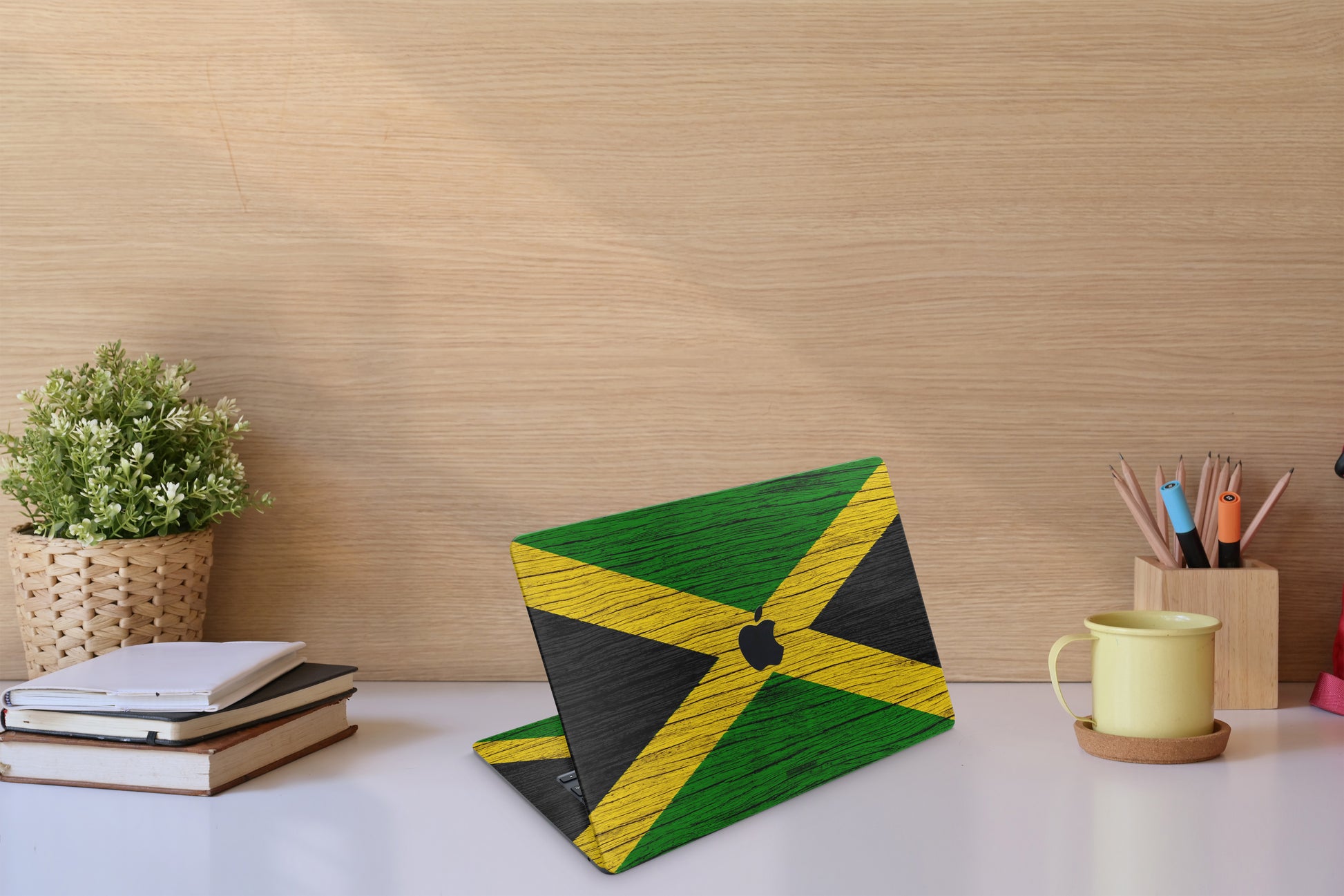 Elevate your MacBook with our Jamaican skin decals. Immerse yourself in the vibrant colors and culture of Jamaica while protecting your device. Upgrade your laptop&#39;s style with this unique design!