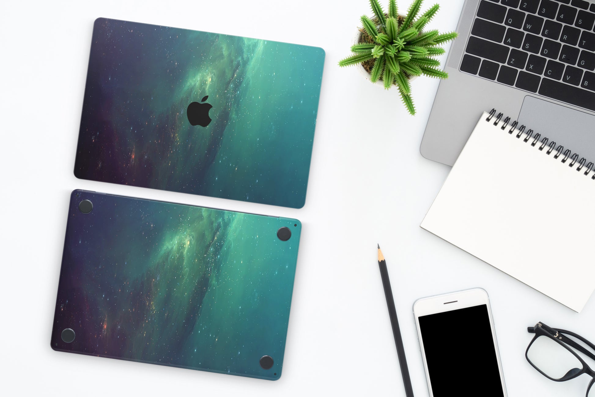 Close-up view of a Nebula Green Stars MacBook skin decal, featuring a vivid green nebula with shimmering stars scattered throughout, creating a celestial and enchanting scene.