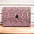 Elevate your MacBook with our Pink Cobra Floral skin decal. Embrace the bold elegance of cobra-inspired floral patterns while protecting your device. Upgrade your laptop's aesthetic with this unique design!