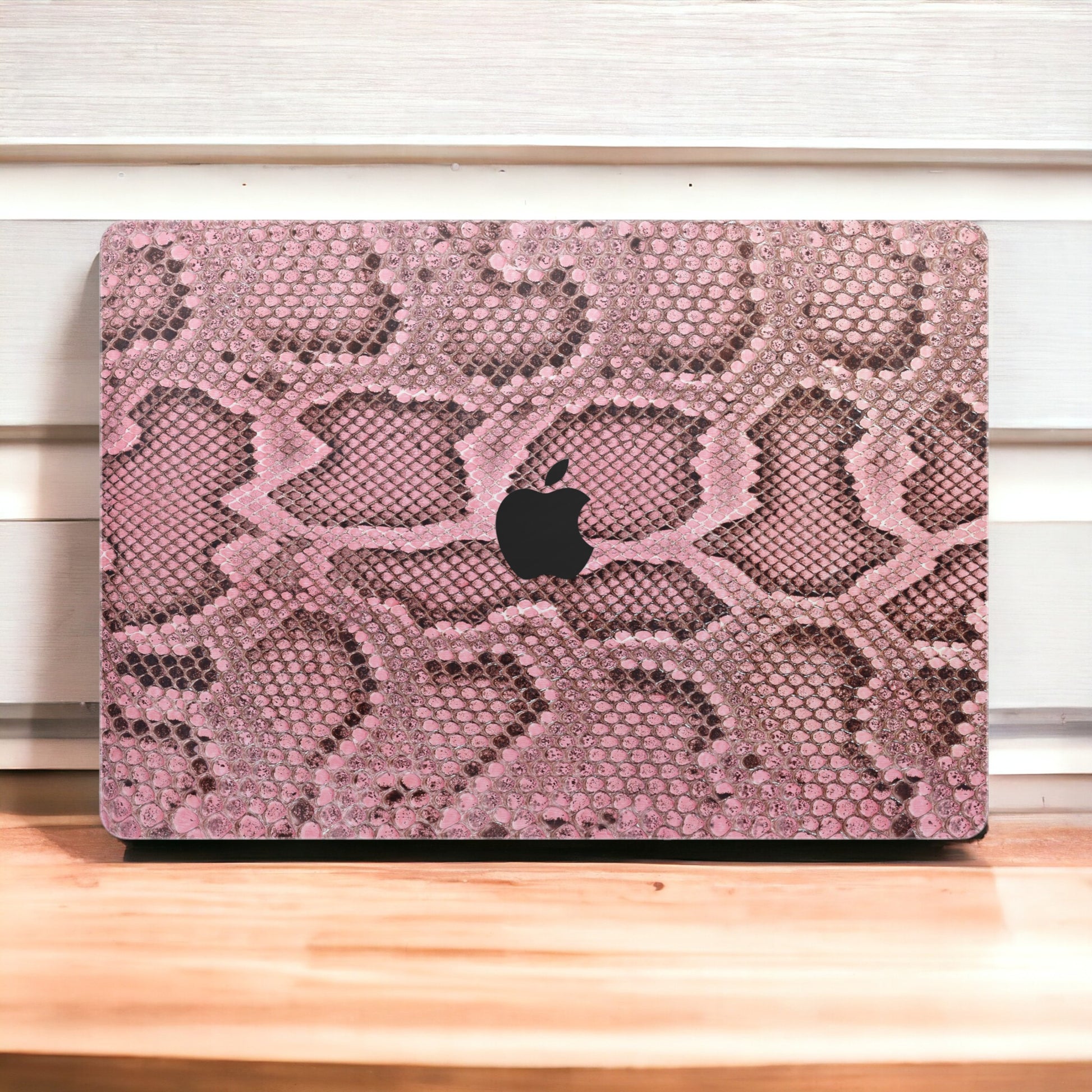 Elevate your MacBook with our Pink Cobra Floral skin decal. Embrace the bold elegance of cobra-inspired floral patterns while protecting your device. Upgrade your laptop&#39;s aesthetic with this unique design!