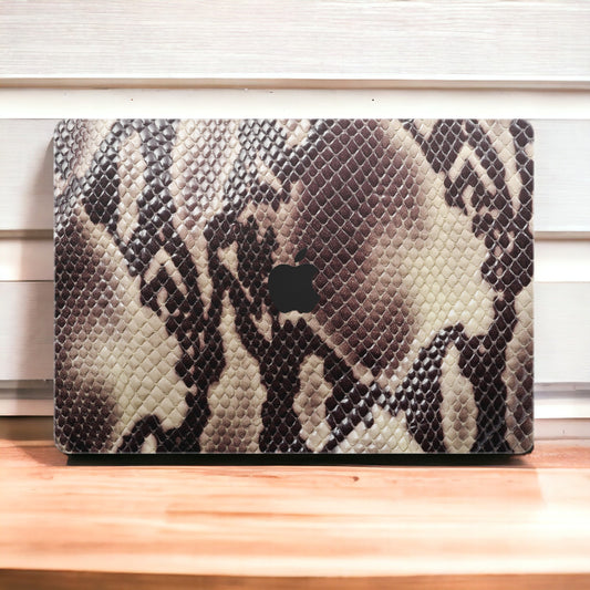 Elevate your MacBook with our Cobra skin decal. Embrace the bold elegance of cobra-inspired floral patterns while protecting your device. Upgrade your laptop&#39;s aesthetic with this unique design!