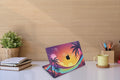 Close-up view of a Sunset Theme Dragon design MacBook skin sticker decal, featuring a majestic dragon against a backdrop of vibrant sunset colors, with fiery hues blending into the sky.