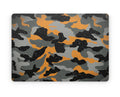 Close-up view of a Camo pattern MacBook skin sticker decal, featuring a classic camouflage design in shades of green, brown, and black